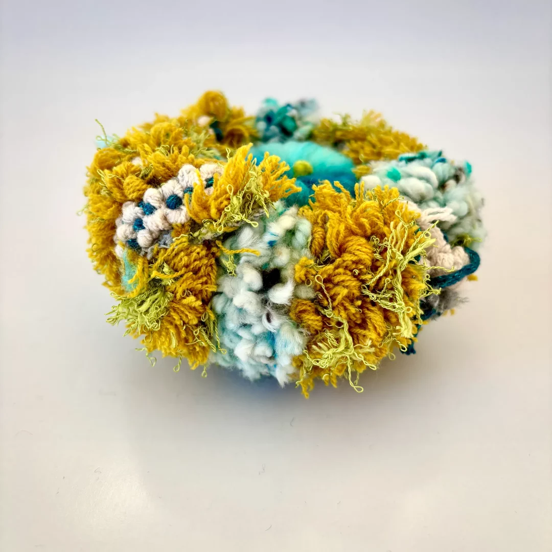 Fragment - P-005 — 7 × 7 cm — 2025
Tufted and carded wool.
Sea urchin flower.